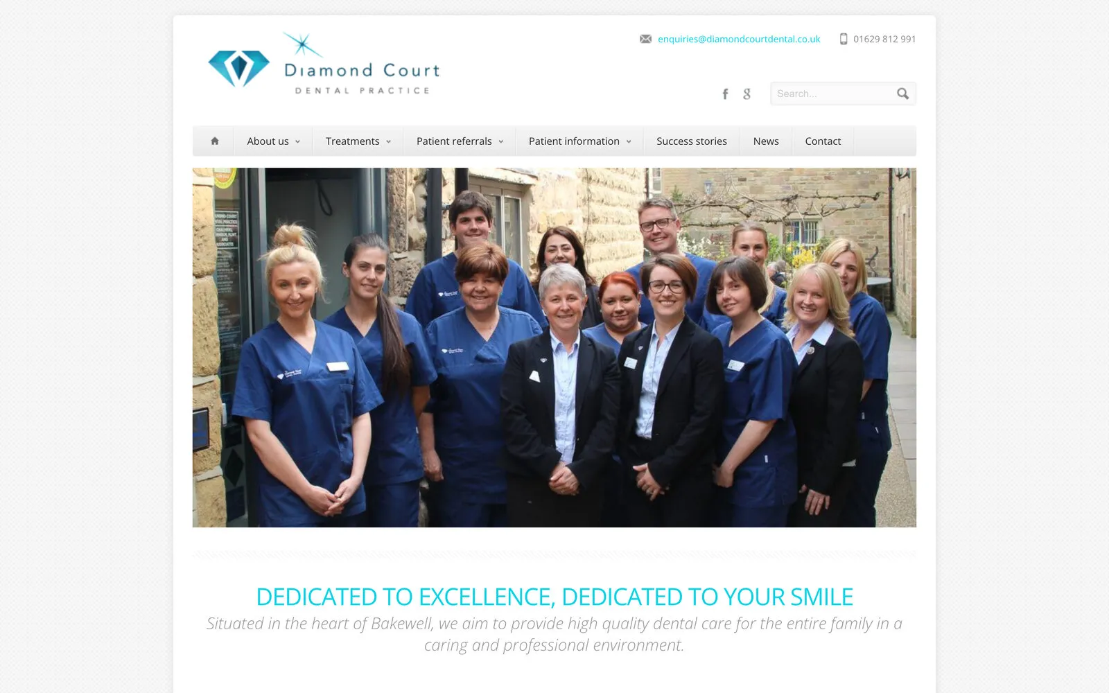 Diamond Court Dental Practice’s home page: the diamond logo and menu above a photo of the team outside the practice