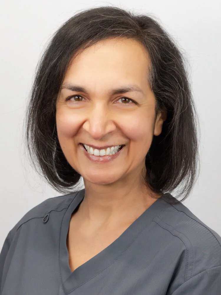 Portrait of Dr Ghazala Ahmad-Mear on the grey backdrop