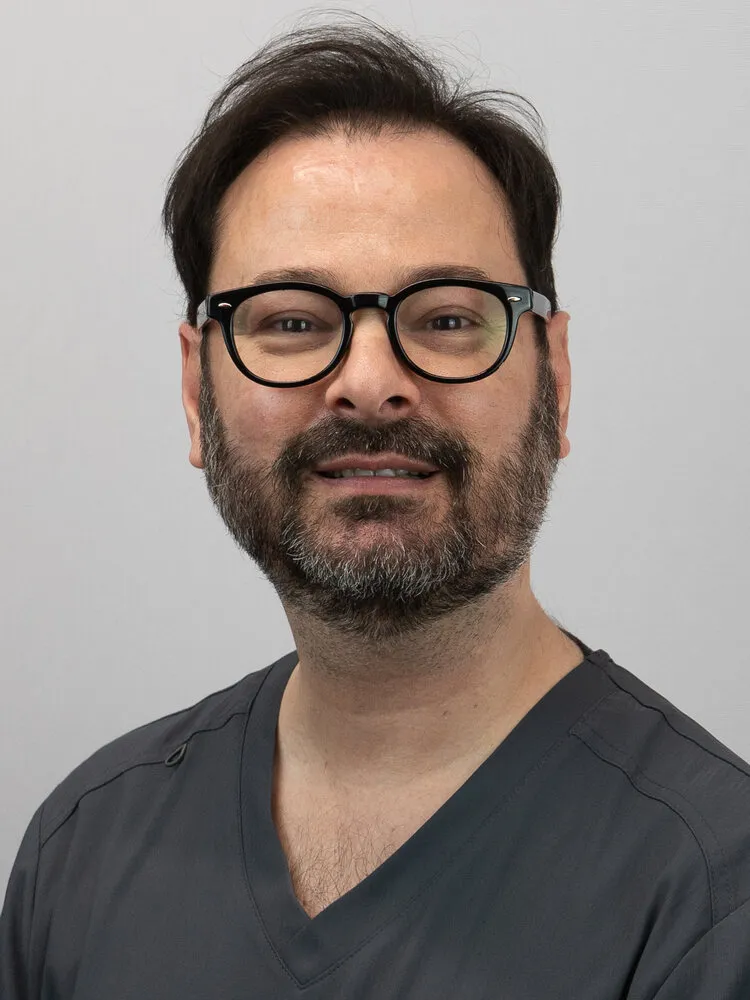 Portrait of Dr Leo Duran on the grey backdrop