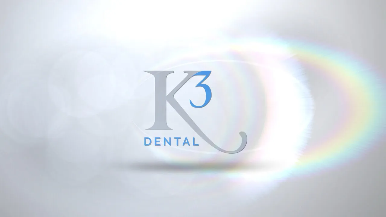 The K3 Dental mark on soft white with a rainbow lens flare: the five-second logo intro