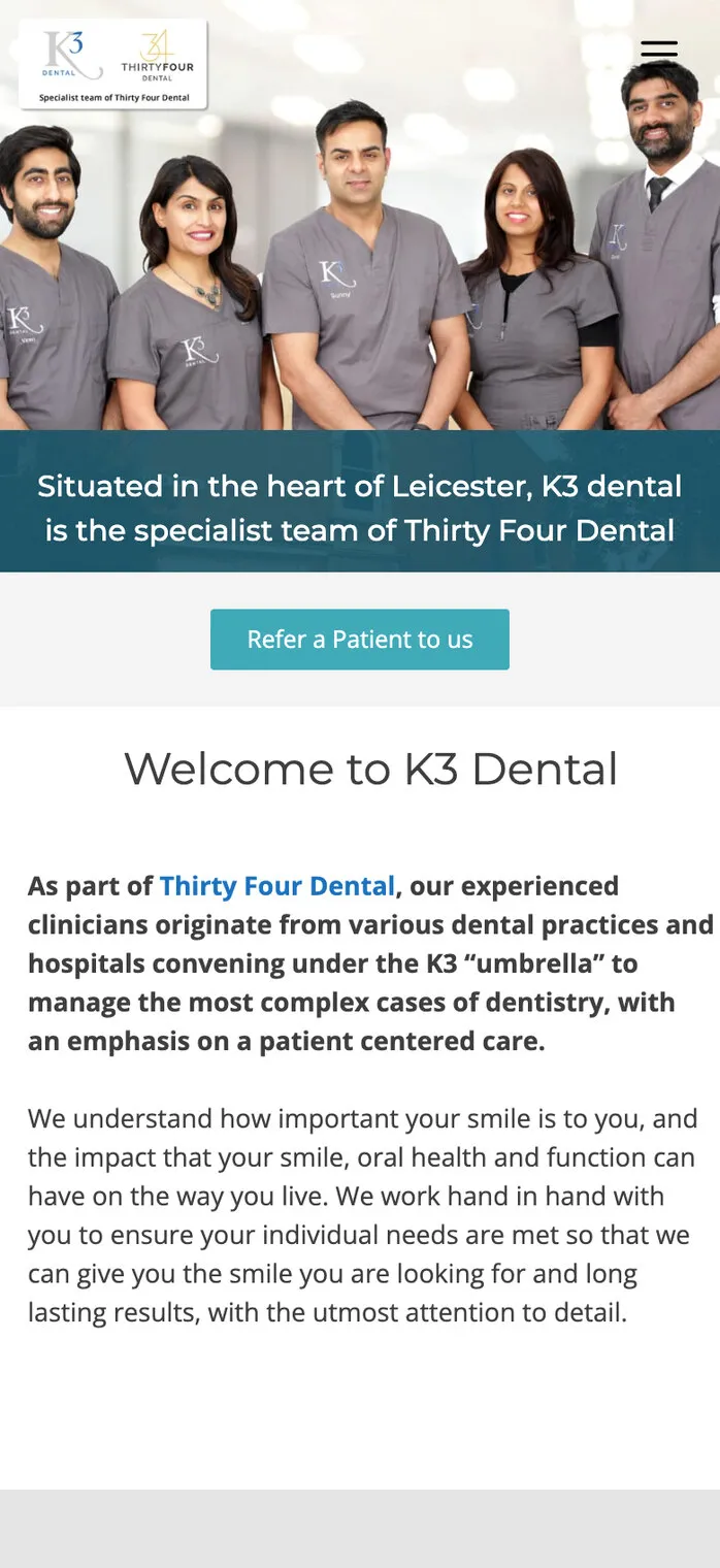 The same home page on a phone: the team photo, the Refer a Patient to us button and the welcome, with the K3 “umbrella” line