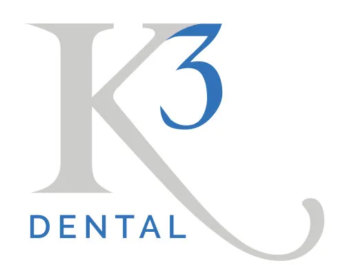 The K3 Dental mark: a light grey K with a long swash, a blue superscript 3 and DENTAL in blue capitals
