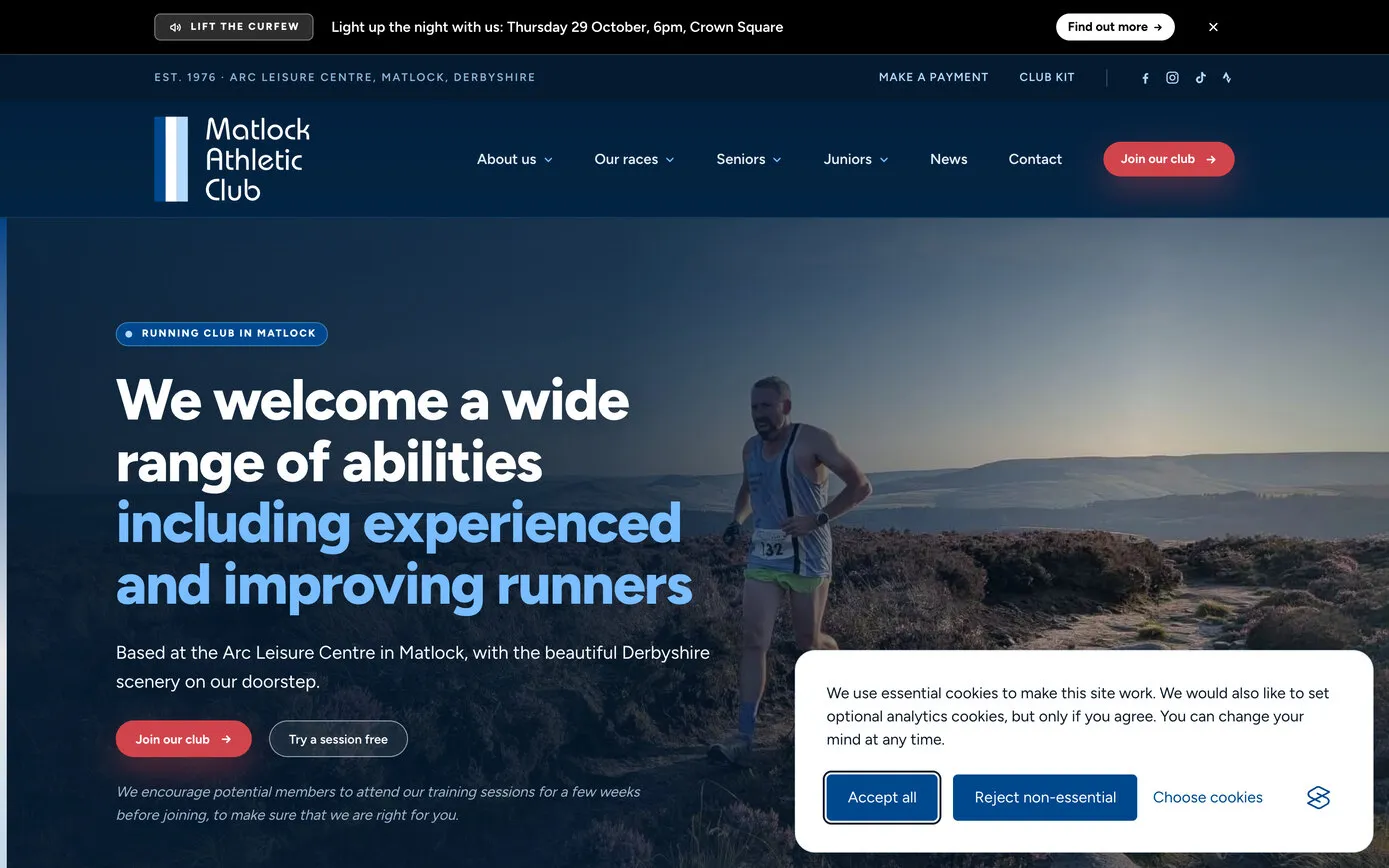 The new homepage as a first-time visitor sees it: a runner on gritstone rocks at dusk, the same welcome line in white and sky blue, and a cookie banner in the corner with “Accept all” and “Reject non-essential” buttons