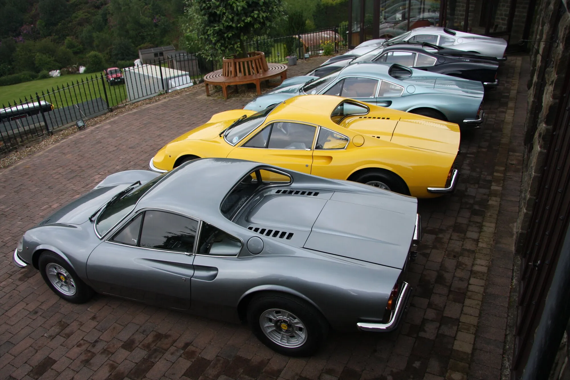 Grey, yellow and blue Dinos lined up, seen from above