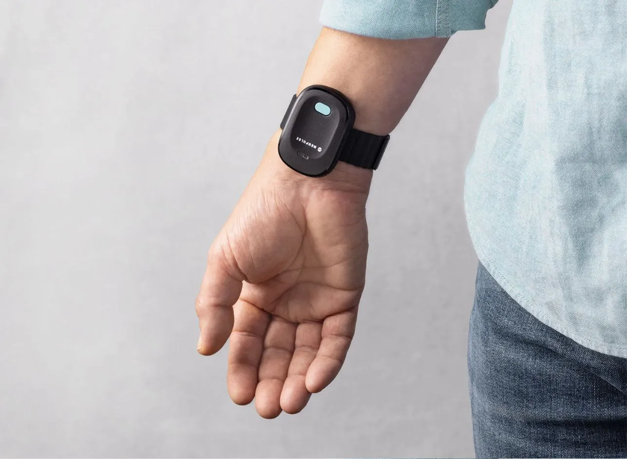 The Neupulse device, worn on the wrist, with the logo on its face