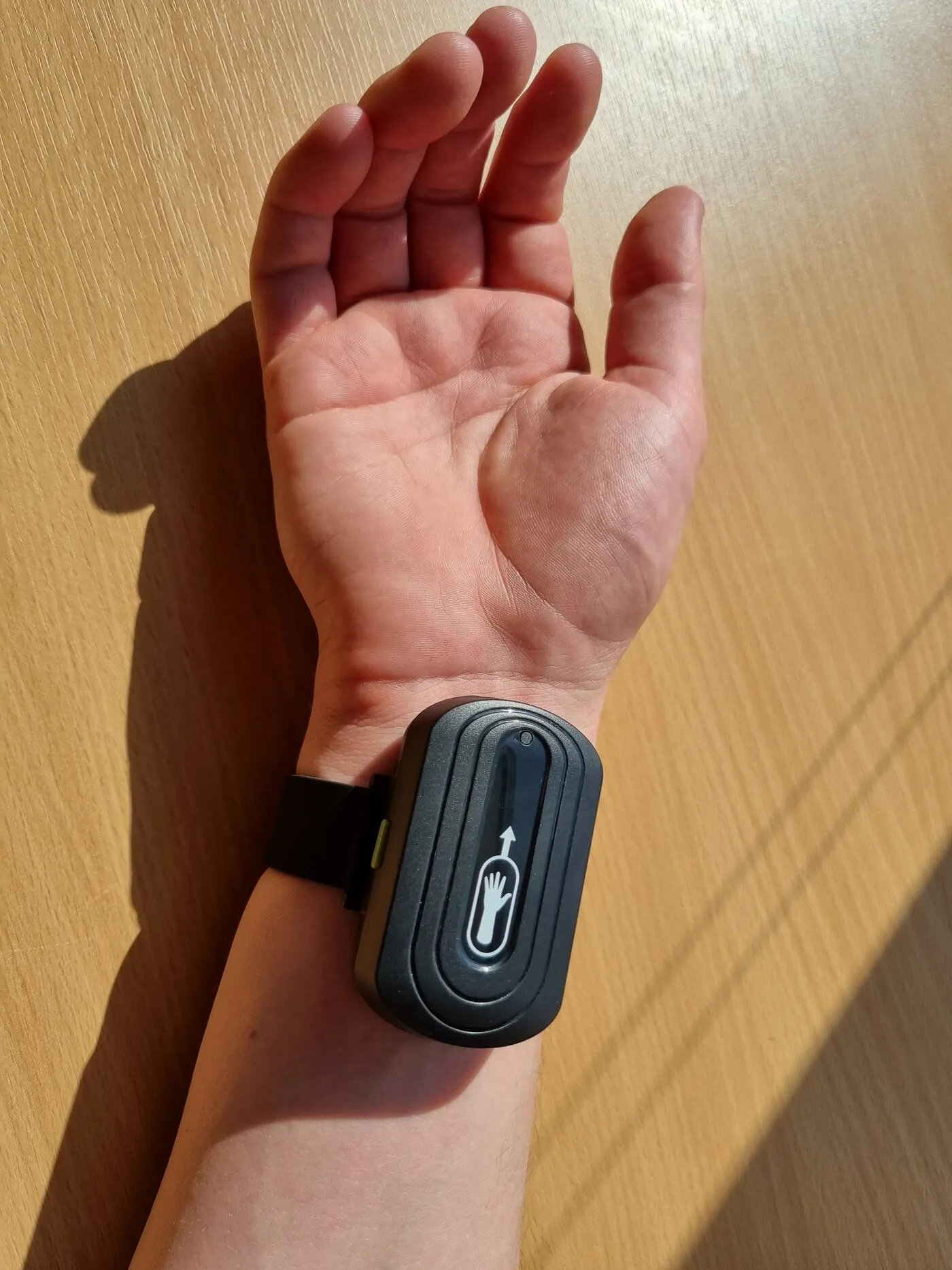 The trial prototype on the inside of a wrist, palm up
