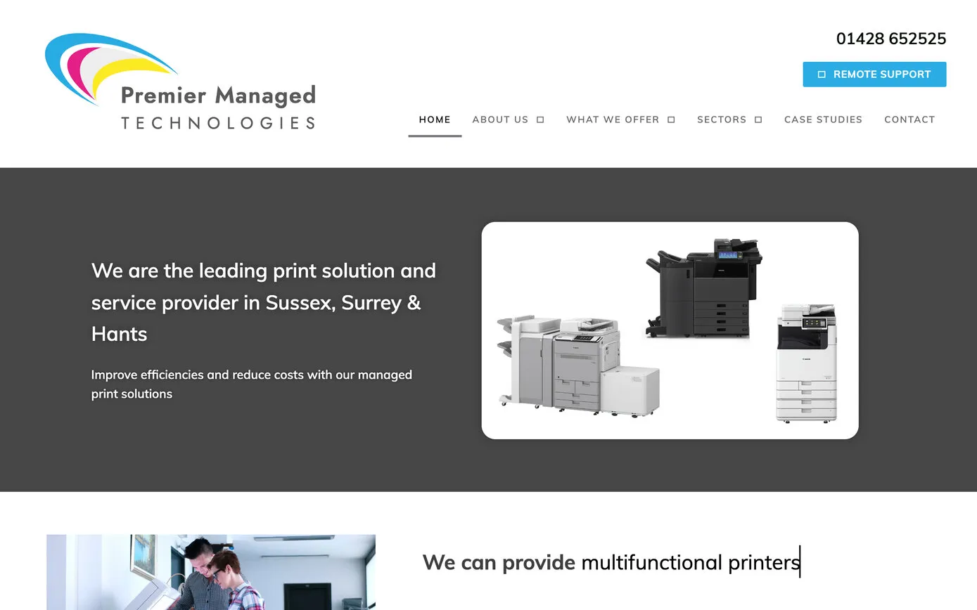 Our 2021 home page: the new logo on white, a cyan Remote Support button, and “We are the leading print solution and service provider in Sussex, Surrey & Hants” beside Canon and Toshiba machines on a dark grey band