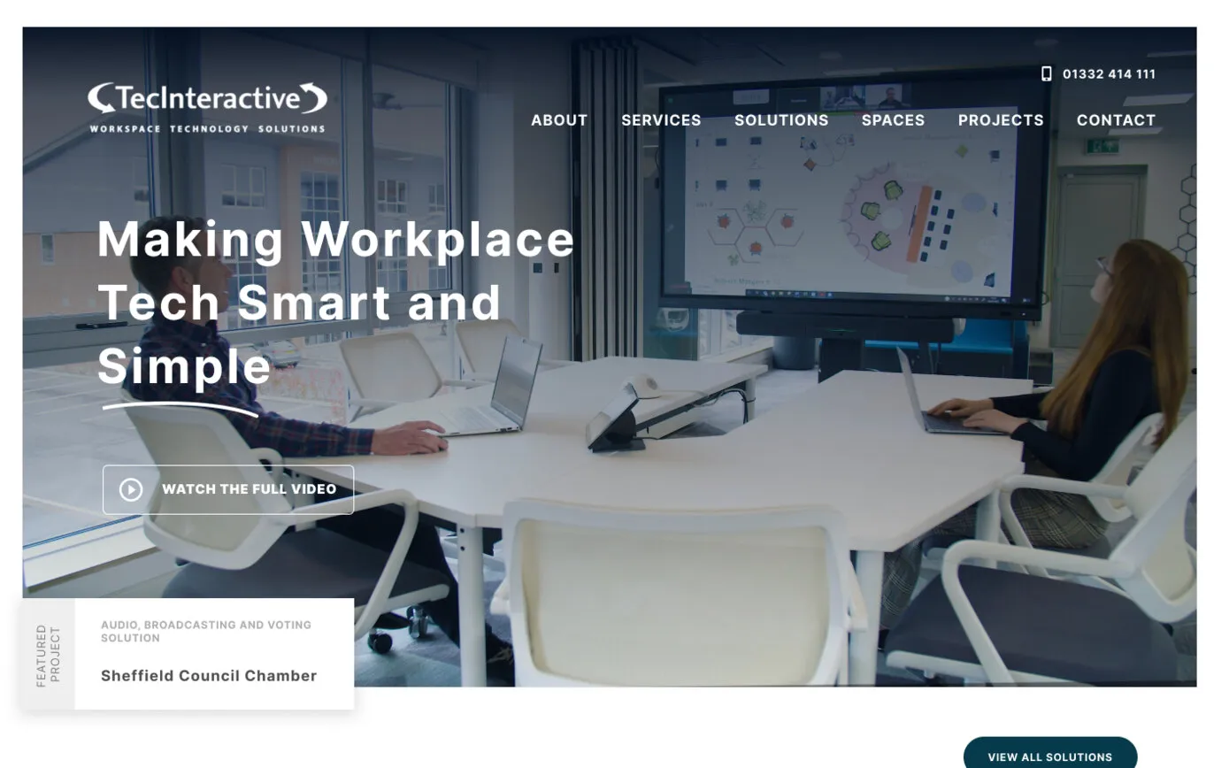 Our 2023 design in Figma: “Making Workplace Tech Smart and Simple” over a meeting room, with a Watch the full video button and the Sheffield Council Chamber project