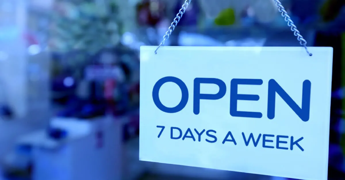 The Open 7 days a week advert, 2016: a hanging shop sign reading “OPEN 7 DAYS A WEEK”