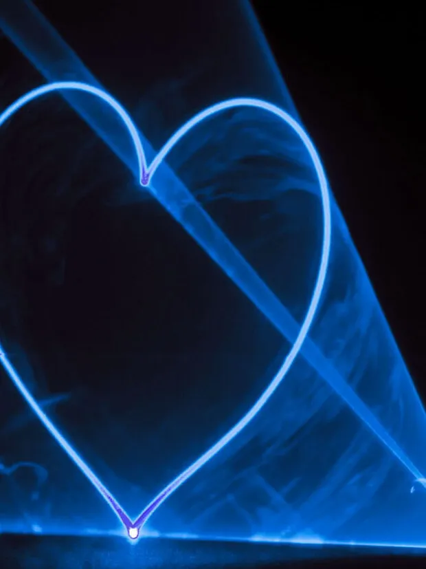 A heart drawn in blue laser light