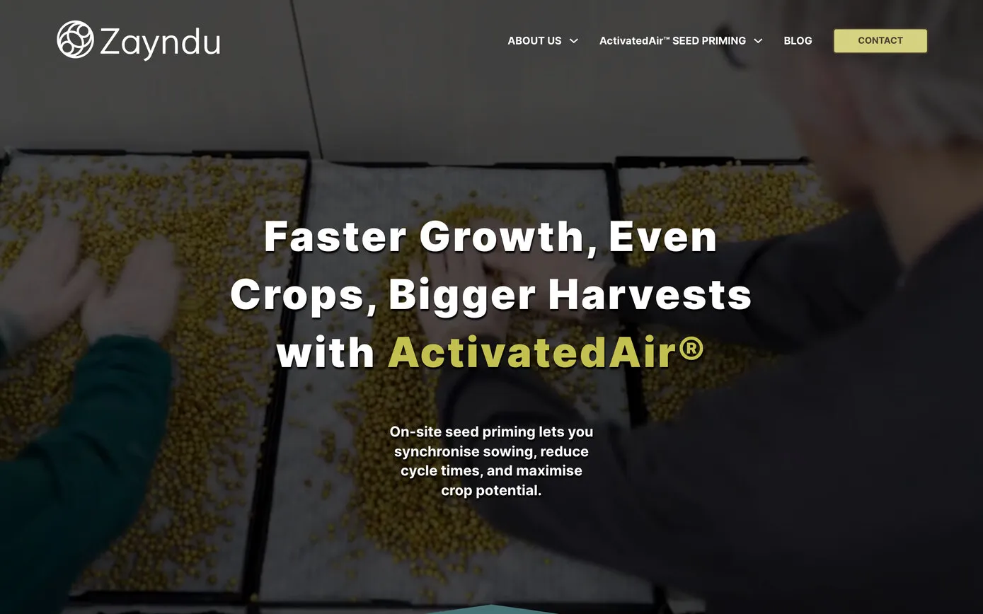 The Zayndu home page today: “Faster Growth, Even Crops, Bigger Harvests with ActivatedAir®” in white and straw over a dark film of seeds being spread on trays