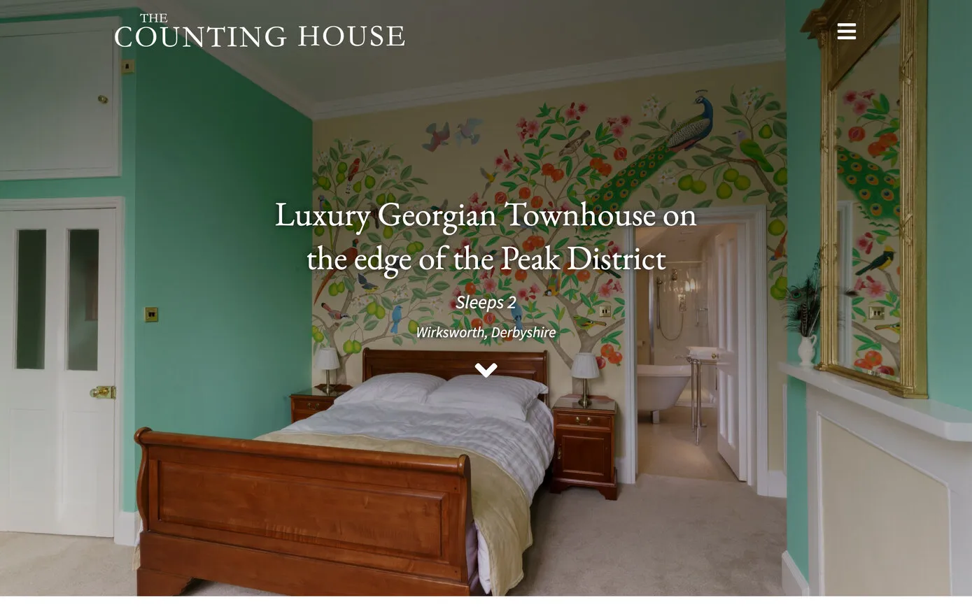 The Counting House website: a bedroom with a mural of birds and fruit trees